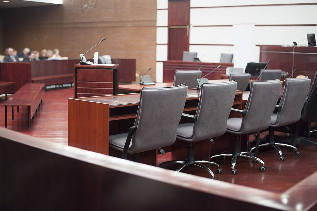 picture of courtroom and jury chairs.